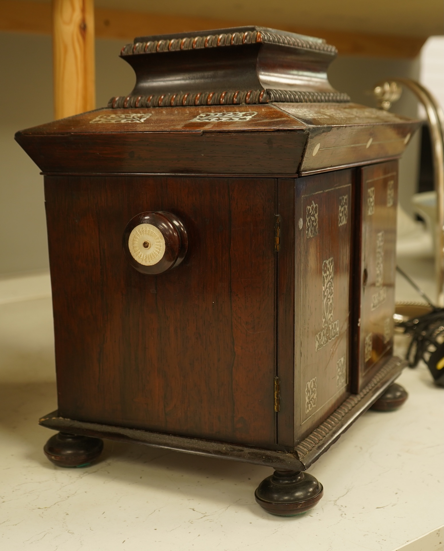 A William IV rosewood and mother of pearl inlaid sewing and writing cabinet with tooled Moroccan leather fitted interior, 37cm high
